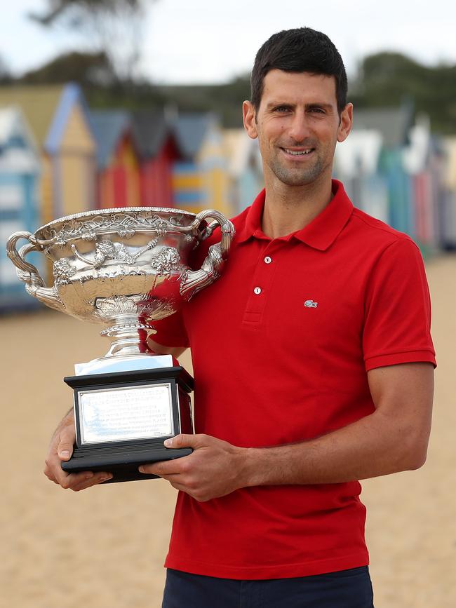 Novak Djokovic poses with the Norman Brookes Challenge Cup after winning the Australian Open. Picture: Graham Denholm/Getty Images