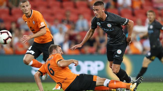 Lachy Wales is tackled by Brisbane defender Avram Papadopoulos.