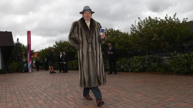 A man in a fur coat arrives for the Melbourne Cup at Flemington Racecourse. He won’t have bought it at a Burnside market, though. Picture: AAP/Julian Smith