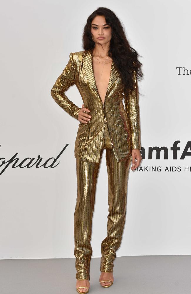 Shanina Shaik’s gold suit featured a plunging neckline. Picture: Phil Loftus/Capital Pictures / MEGA