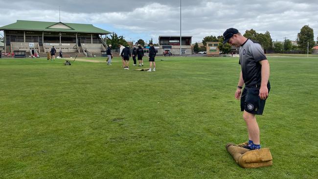 VSDCA: Brunswick players help prepare the AG Gillon Oval pitch. Picture: Valeriu Campan