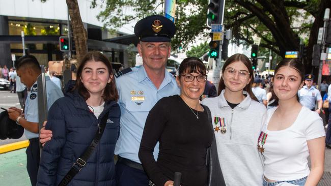 Thousands of people have braved the rain to gather in Brisbane for Anzac Day services. Picture: Grace Kessels