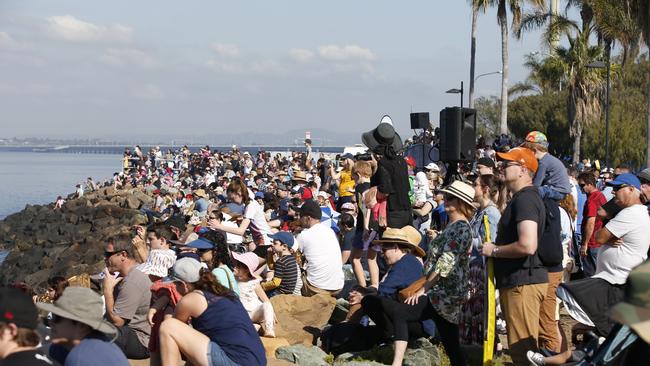 A crowd gathers to watch the Jetpack Superheroes in action at Redcliffe KiteFest in 2019. Picture: AAP/Regi Varghese.