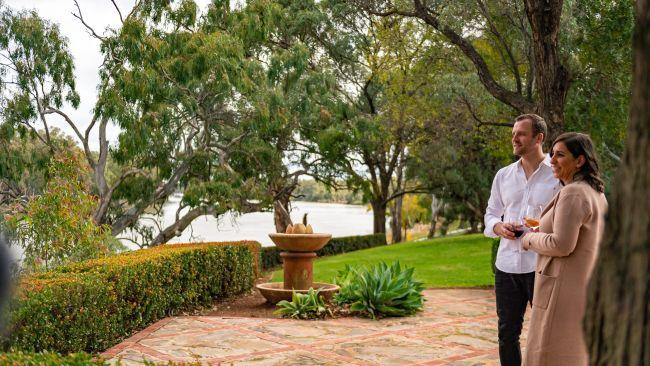 Sampling a glass at Trentham Estate. Picture: Visit Victoria