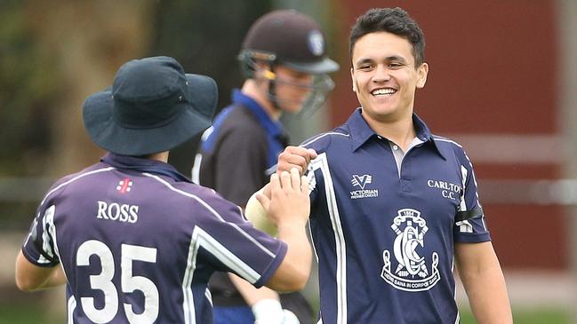 Carlton’s Matthew Wilson celebrates the wicket of Jarrod Martignago with teammate Nick Ross. Picture: Hamish Blair