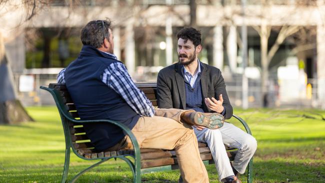 Lawyer Aleksandar Dukovski speaking to the client. Picture: Jason Edwards