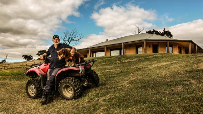 Malcolm Hackett with his dog Jock at his home in Strathewen. Picture: Julian Kingma