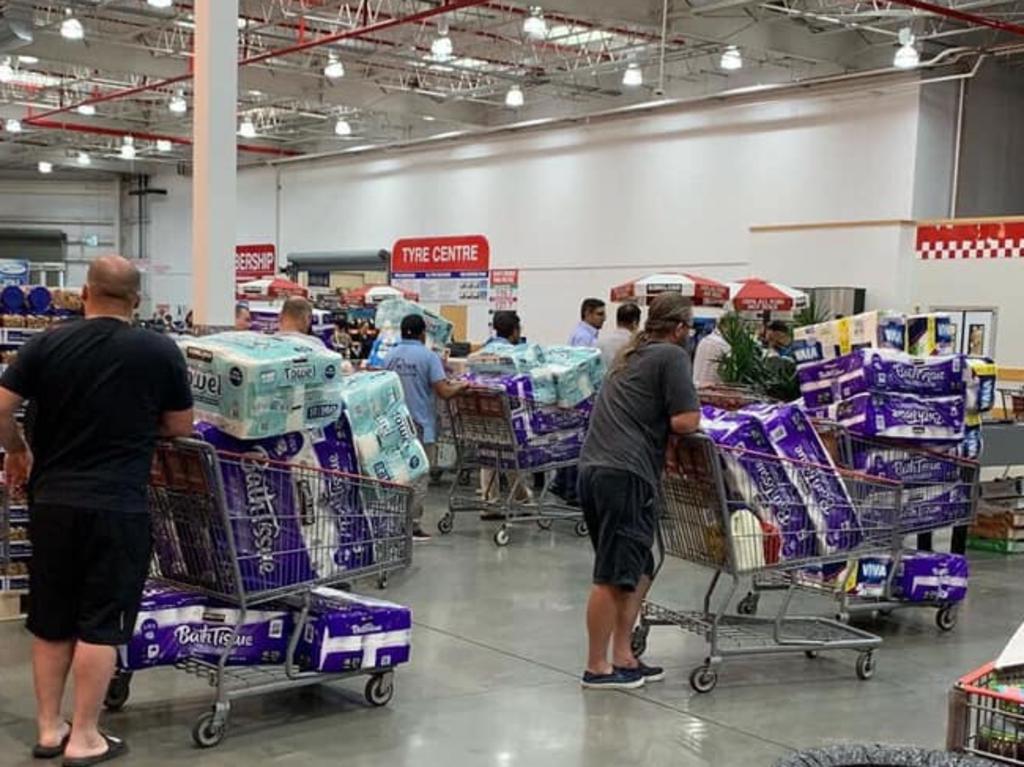 Was this the picture they started the loo roll panic? Customers at a Costco warehouse store in Sydney left the shelves empty of toilet tissue. Picture: Facebook.