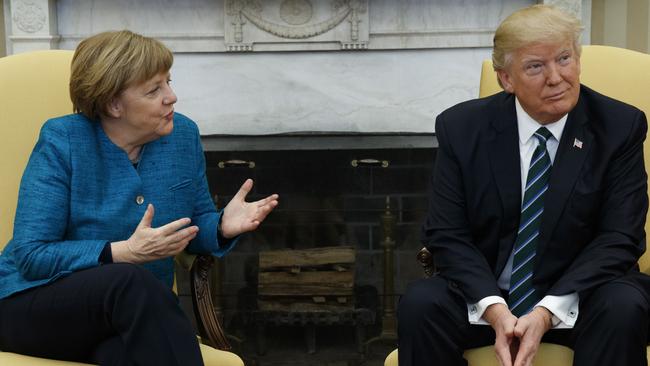 President Donald Trump reportedly handed German Chancellor Angela Merkel the invoice during their meeting at the White House. Picture: Evan Vucci/AP Photo