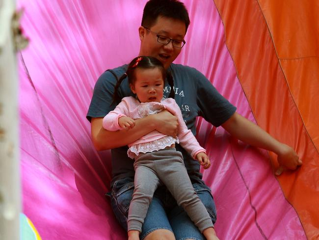 Families share the fun of the fair.