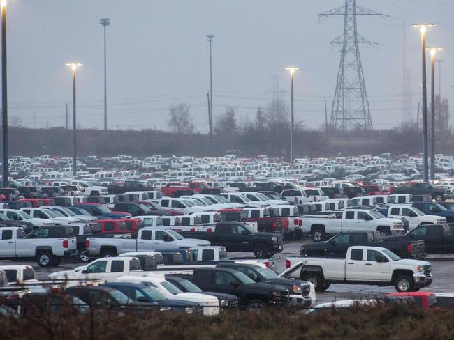 Hundreds of General Motor vehicles are parked outside the GM Assembly plant in Oshawa, Ontario on November 26, 2018. - General Motors is to announce on Monday the closure of a factory in Canada, putting almost 3,000 jobs at risk, Canadian news media reported. The decision is part of the US automaker's plans for a comprehensive global restructuring, channel CTV reported Sunday, citing several anonymous sources. Other media, including Radio-Canada/CBC, had similar reports. (Photo by Lars Hagberg / AFP)