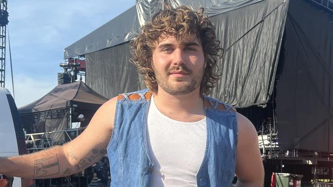 Noah Blockley of rock band The Rions cooling down backstage.