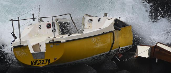 A yacht has been left on the rocks at Burleigh Headland. (Photo/Steve Holland)