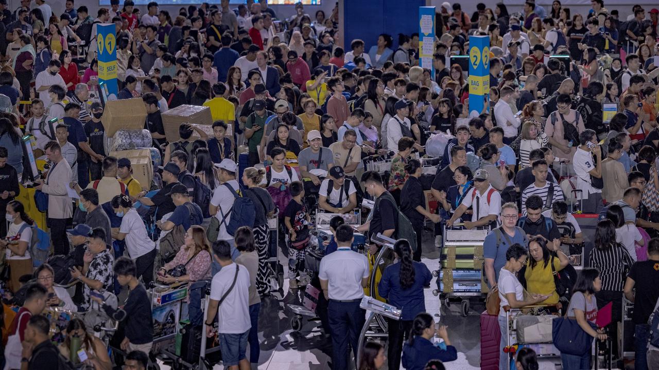 Long queues of passengers at Ninoy Aquino International Airport in Manila, Philippines. Picture: Ezra Acayan/Getty