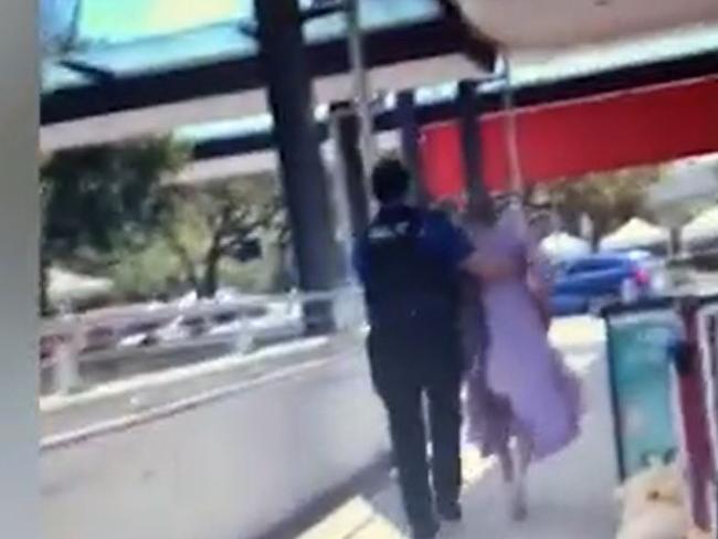 Video shows the man, believed to have mental health issues, being frogmarched out of one of Brisbane's busiest hospitals on Sunday. It has forced health authorities to alter how they discharge patients. Picture: Supplied/NCA NewsWire