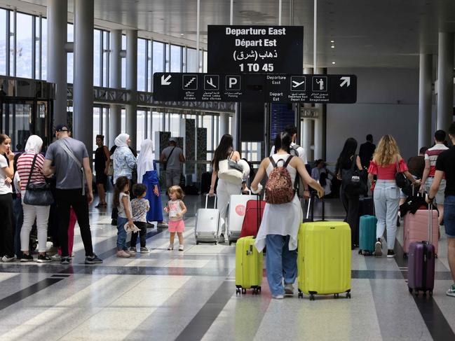 Passengers departure from Rafic Hariri International Airport in Beirut on July 29, 2024. Airlines suspended flights to Lebanon on July 29, as diplomatic efforts were underway to contain soaring tensions between Hezbollah and Israel after deadly rocket fire in the annexed Golan Heights. (Photo by Anwar AMRO / AFP)