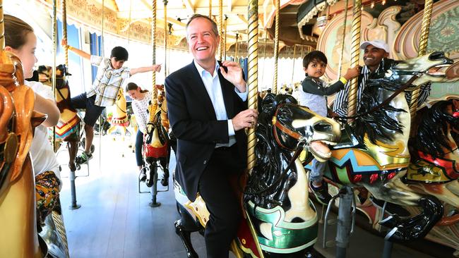 Shorten riding the carousel at Luna Park in Melbourne. Picture: Kym Smith