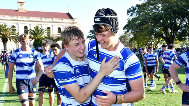 Tireless Nudgee flanker Ben Didonna (left) celebrates the premiership with teammates. Picture, John Gass