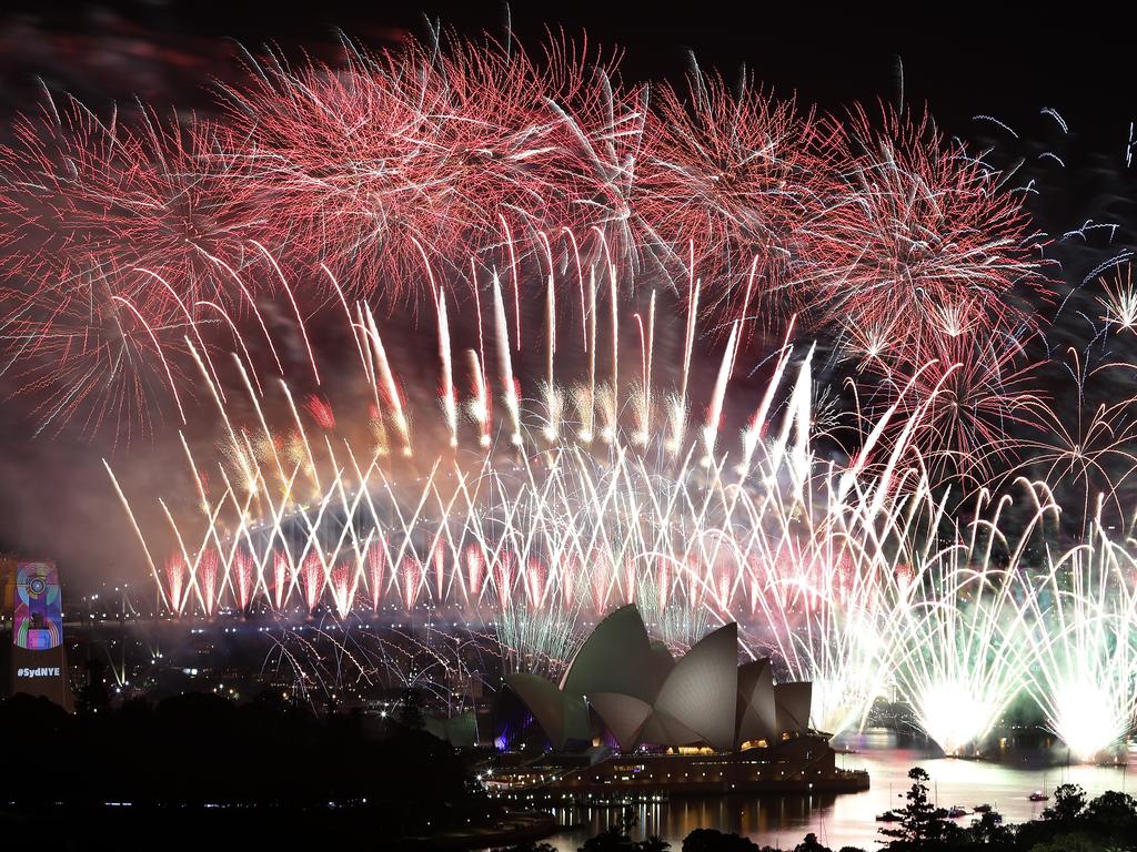 New Year's Eve 2018 - The midnight fireworks display over the Sydney Opera House and Sydney Harbour Bridge from a rooftop in Potts Point. Picture: Toby Zerna