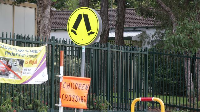 The hydro house is seen behind the yellow cross walk sign next to Bankstown West Public school. Picture: Tim Clapin