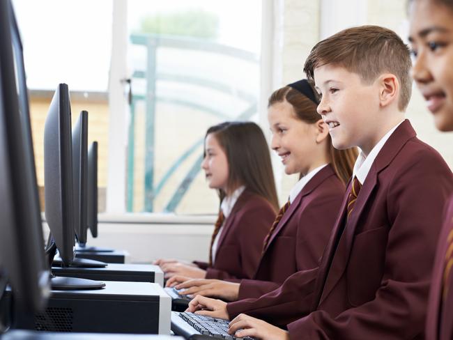 QST - Schools of excellence feature - generic school pic - pupils enjoying computer class