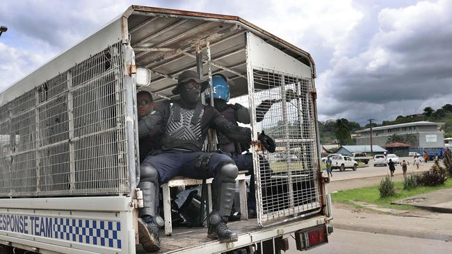 Solomon Riot Squad Police travel through Honiara. Picture: Gary Ramage.