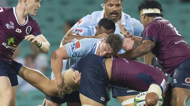 Michael Hooper drives Lukhan Salakaia-Loto into the turf in another display of the Waratahs strong defence. Picture: AAP Image/Craig Golding