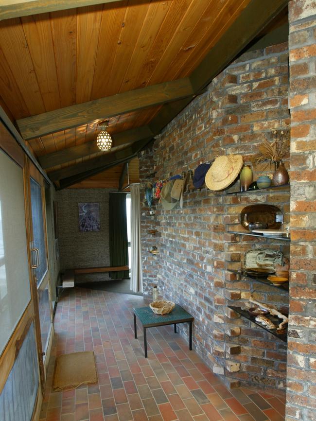 Shelves were created on the exposed brick hallway.