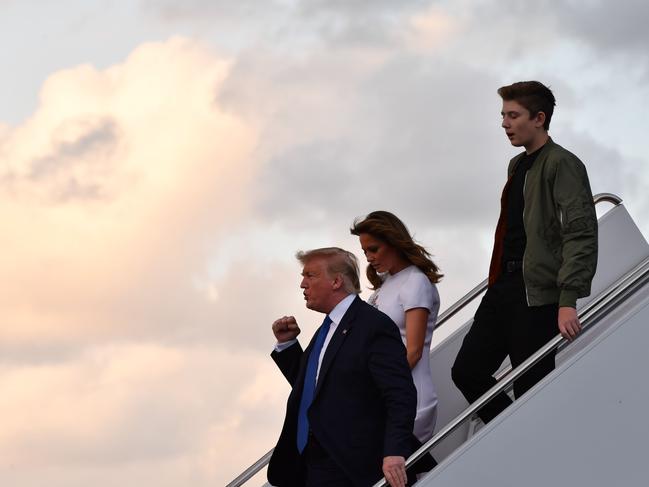 Donald Trump with his wife, Melania, and son, Barron, who also caught COVID-19. Picture: AFP