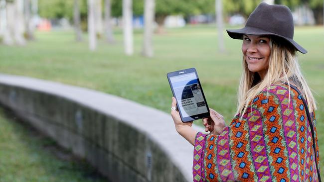 Tulani Lockhart of Whitfield reading the Cairns Post news on the Samsung tablet. PICTURE: STEWART MCLEAN