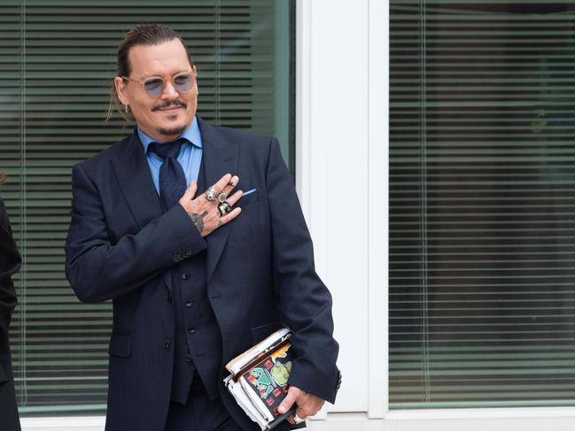 Johnny Depp gestures to fans during a recess outside court during his civil trial against Amber Heard. Picture: AFP.