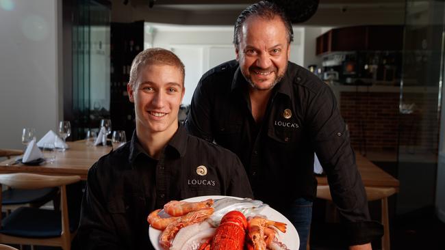Peter Louca and son Dylan with some local seafood at Louca's Restaurant & Grill in Pulteney Street.