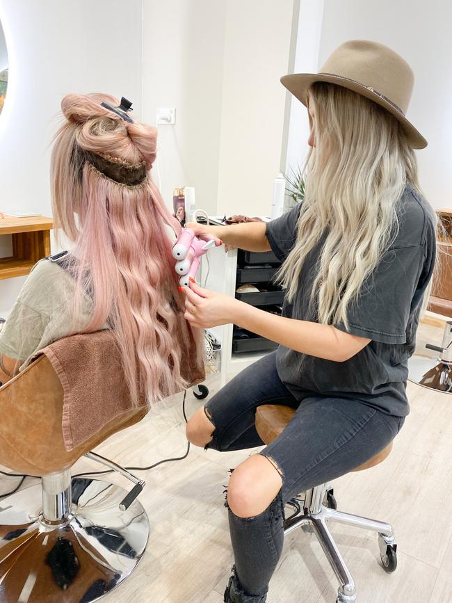 Casey Hopkinson tends to a customer’s tresses of Bodhi Boutique Parramatta.