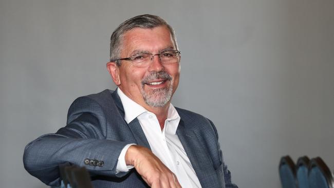 Smiling Villa World CEO Craig Treasure at the scheme meeting Sofitel Broadbeach. Photograph: Jason O'Brien