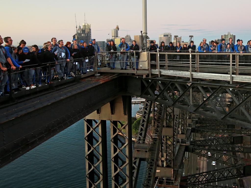 A dawn service was held on the summit of the Sydney Harbour Bridge to commemorate ANZAC Day. Money raised by the members of the public who climbed the bridge went to RSL DefenceCare. Picture: Toby Zerna