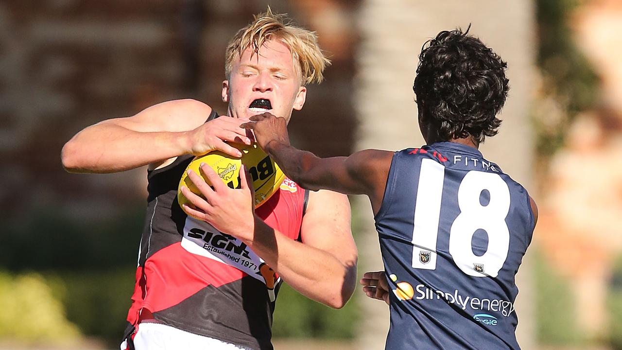 Jack Avery marks in front of Tiger Patrick Kitchener. Picture: Jackson Flindell