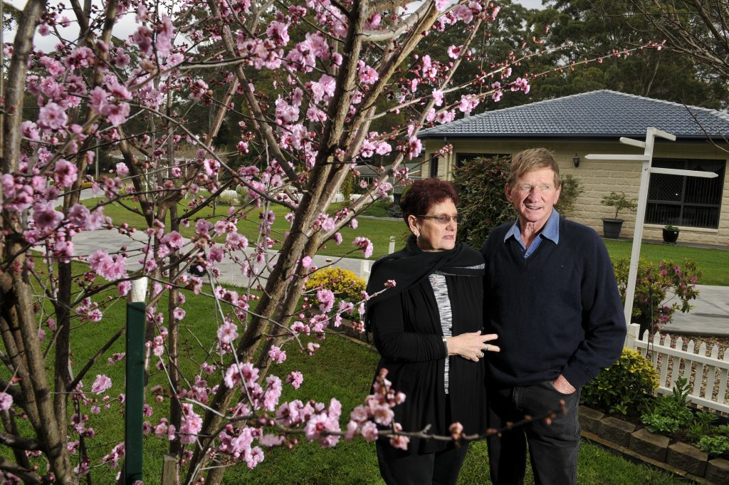 Dianna and Kevin Drew with a flowering plum tree. . Picture: Dave Noonan