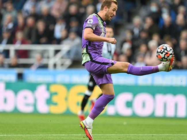 Tottenham Hotspur's English striker Harry Kane shoots to score their second goal during the English Premier League football match between Newcastle United and Tottenham Hotspur at St James' Park in Newcastle-upon-Tyne, north east England on October 17, 2021. (Photo by Paul ELLIS / AFP) / RESTRICTED TO EDITORIAL USE. No use with unauthorized audio, video, data, fixture lists, club/league logos or 'live' services. Online in-match use limited to 120 images. An additional 40 images may be used in extra time. No video emulation. Social media in-match use limited to 120 images. An additional 40 images may be used in extra time. No use in betting publications, games or single club/league/player publications. /