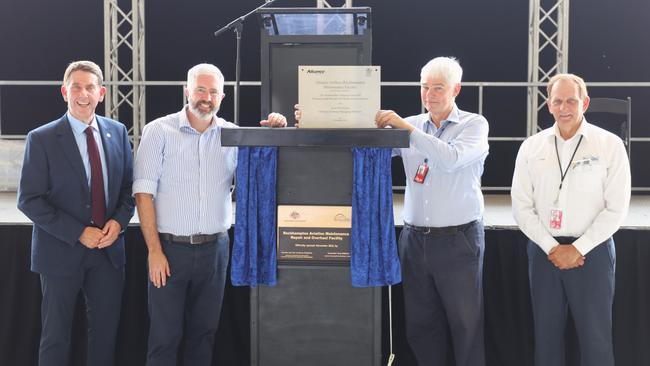 Queensland Treasurer Cameron Dick, Senator Anthony Chisholm, Scott McMillan, and Rockhampton Regional Council Mayor Tony Williams unveil the plaque about the opening of Alliance Airlines new $60 million aviation maintenance, repair and overhaul (MRO) facility at Rockhampton Airport.