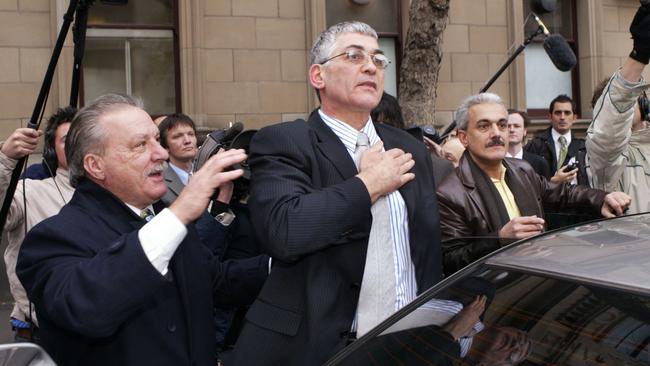 Mick Gatto puts his hand on his heart and thanks supporters outside the Supreme Court after the not guilty verdict.