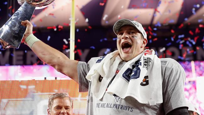 GLENDALE, AZ - FEBRUARY 01: Rob Gronkowski #87 of the New England Patriots celebrates with the Vince Lombardi Trophy after defeating the Seattle Seahawks 28-24 to win Super Bowl XLIX at University of Phoenix Stadium on February 1, 2015 in Glendale, Arizona. (Photo by Christian Petersen/Getty Images)