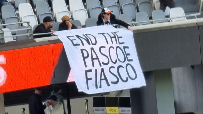 A sign criticising Wests Tigers CEO Justin Pascoe has been removed by security at Commbank Stadium. Picture: Twitter/X.