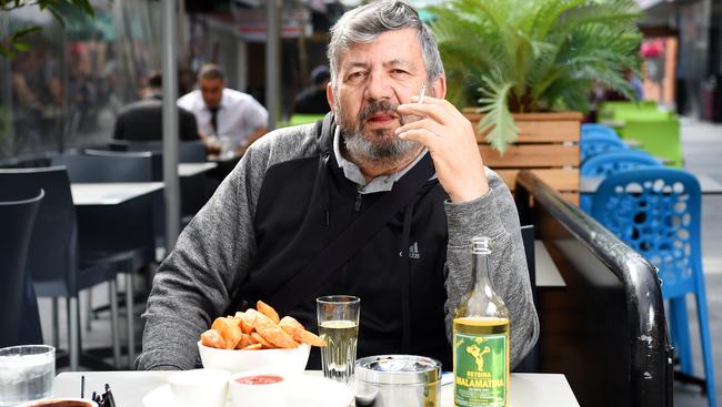 Eaton Mall customer Dimosthenis Kartsiounis enjoying a cigarette with his meal. Picture: Josie Hayden