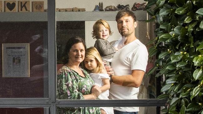 Kristie Young at her home in Langwarrin, Melbourne, with Airlie, 3, Bowen, 18 months, and partner Christopher Morrison. Picture: Aaron Francis