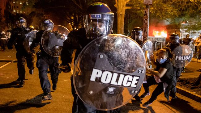 Police charge a protest line outside the White House in Monday AEST. Picture: AFP