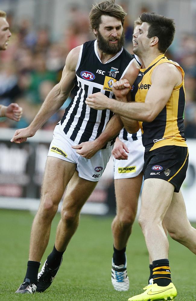 Tiger Trent Cotchin remonstrates with Power forward Justin Westhoff. Picture: Wayne Ludbey