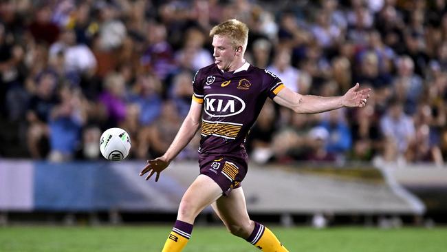 Tom Dearden kicks the ball during the NRL Trial Match against the Cowboys at Moreton Daily Stadium. Photo: Bradley Kanaris/Getty Images