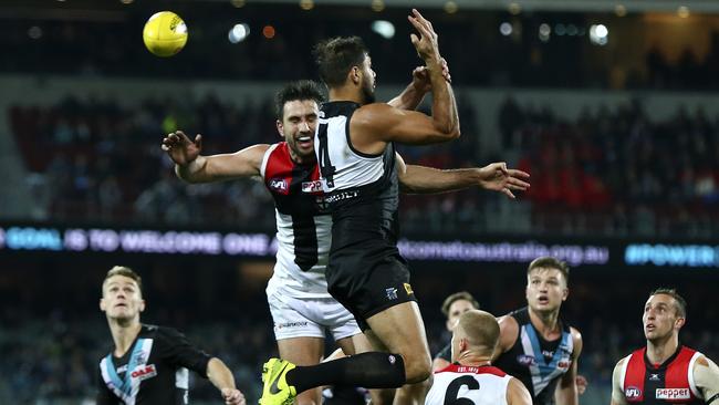 Paddy Ryder taps to Robbie Gray who goes onto kick the winning goal. Picture Sarah Reed