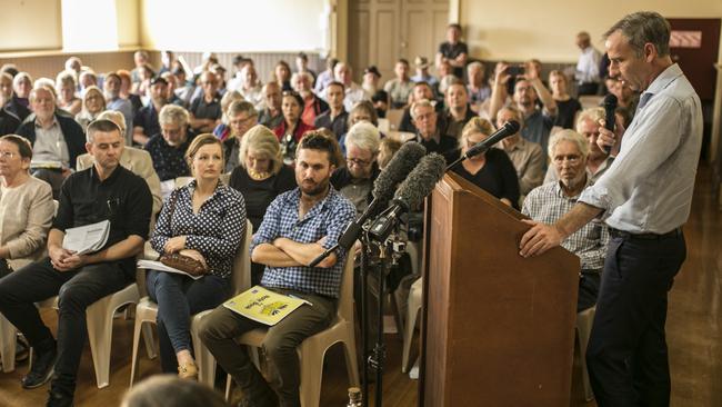 Simone and Daniel Hackett, front centre, listen to Nick McKim speak at the Central Highlands Council meeting. Picture: EDDIE SAFARIK 