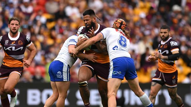 BRISBANE, AUSTRALIA – JULY 27: Payne Haas of the Broncos is tackled during the round 21 NRL match between Brisbane Broncos and Canterbury Bulldogs at Suncorp Stadium, on July 27, 2024, in Brisbane, Australia. (Photo by Albert Perez/Getty Images)